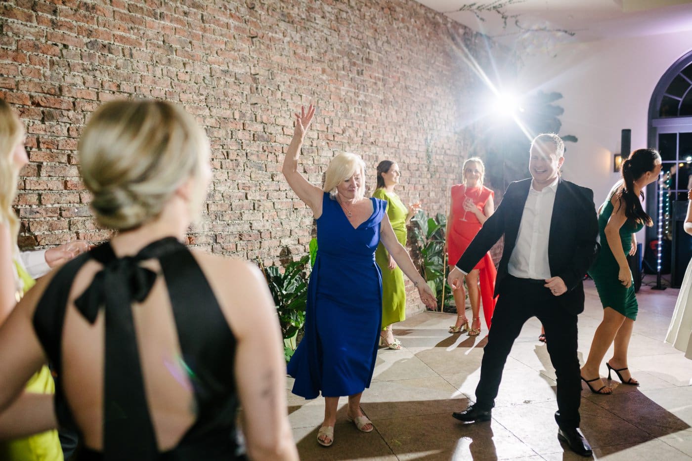 during the reception two people had their hair down dancing