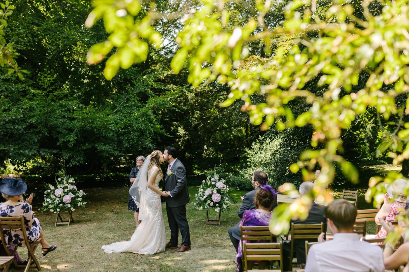 A stunning view of the hackthorn walled garden frames a spirited wedding and vibrant weddings celebration, blending heritage with beauty.