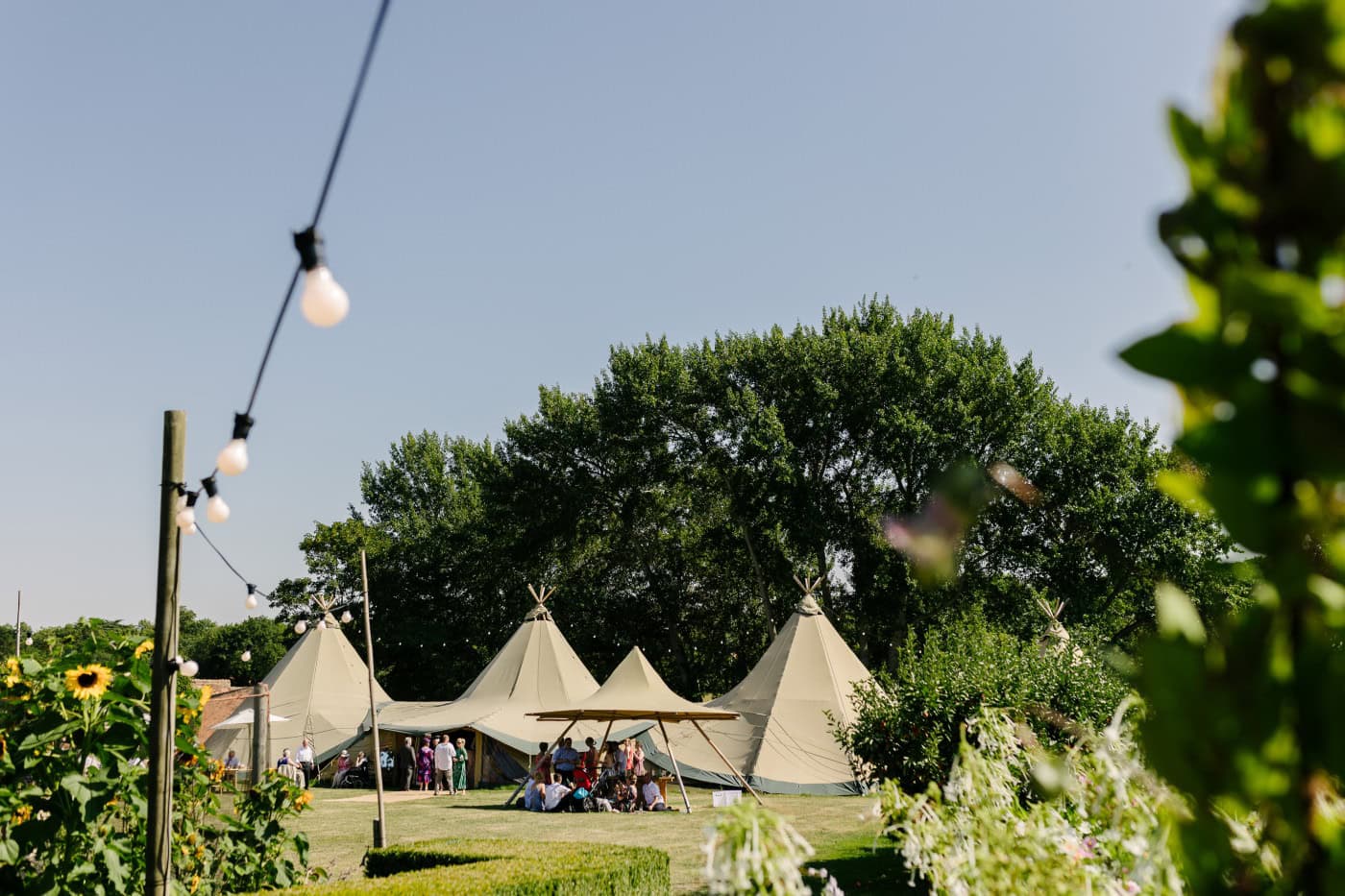 In the hackthorn walled garden, gentle shadows and golden light create a backdrop filled with heartfelt emotion and genuine connection.