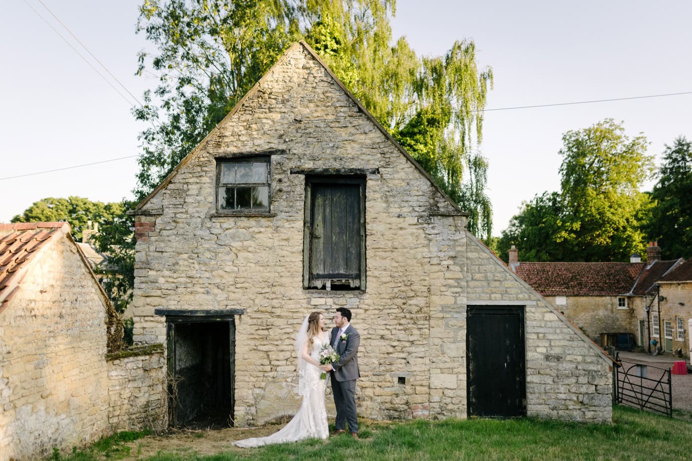 A relaxed moment shows the couple’s natural expressions shining through against a backdrop of vibrant nature.