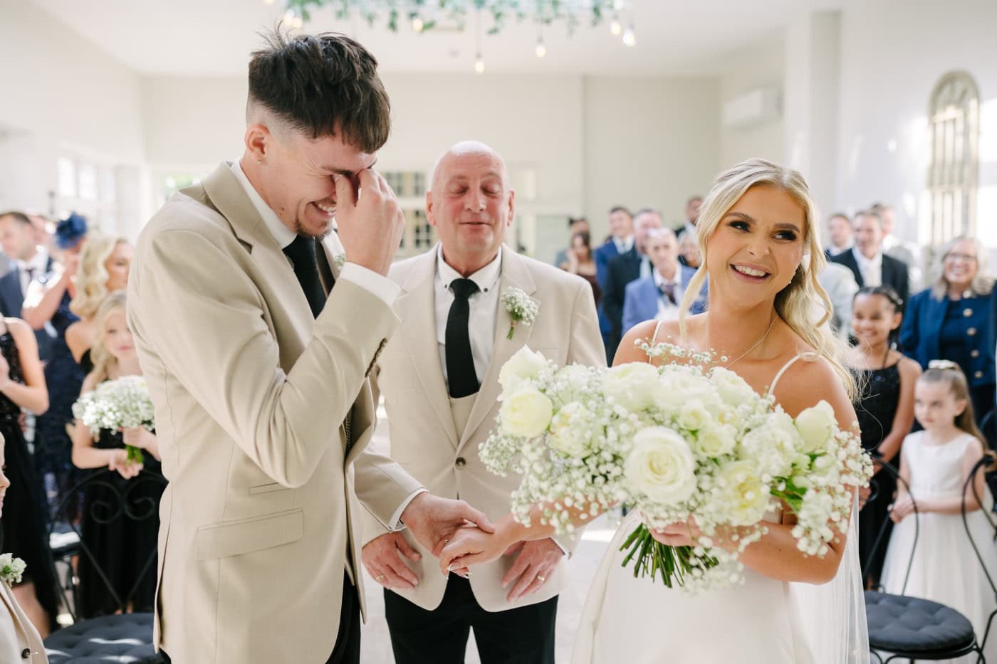 The smiling bride lit up the room alongside her bridesmaids.