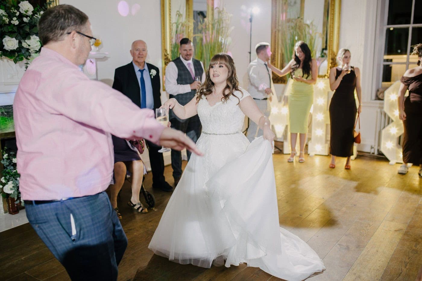 The bride dancing with her guests