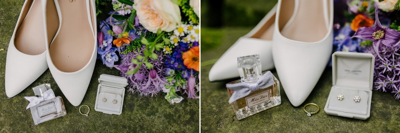 Bridal shoes, rings and a colourful wildflower bouquet laid out on the wedding morning