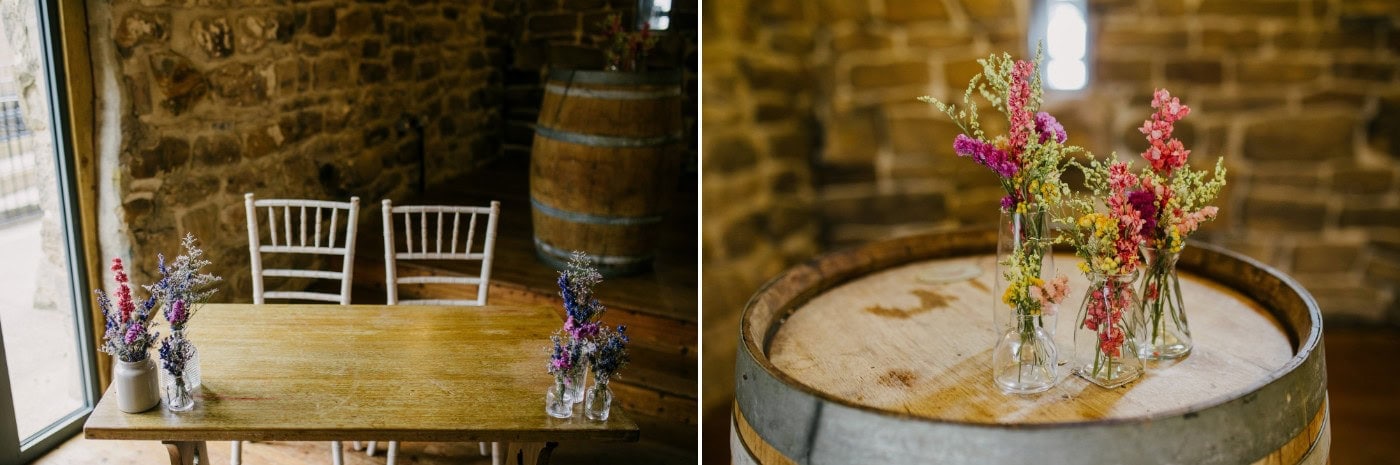 Barrel tables and wildflowers that Ellie styled herself around the venue at Danby Castle