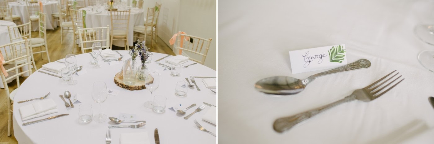 Wedding breakfast tables with wildflowers and barrels in the Danby Castle barn