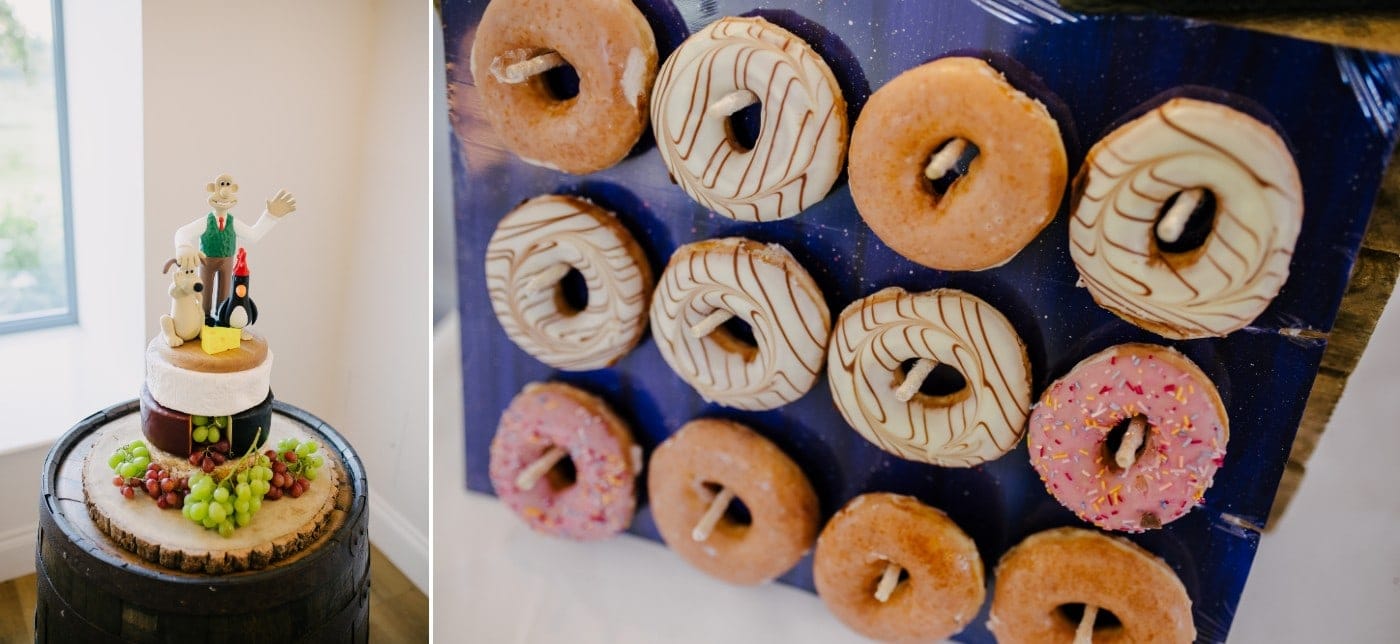 Wedding cake and a doughnut wall on the dessert table in the barn at Danby Castle