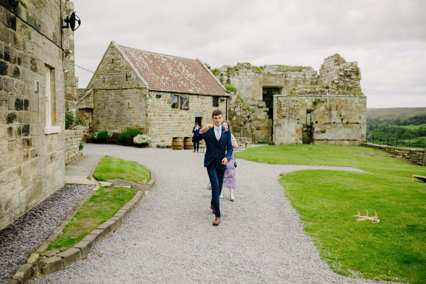 George walking up the lane towards Danby Castle before the ceremony