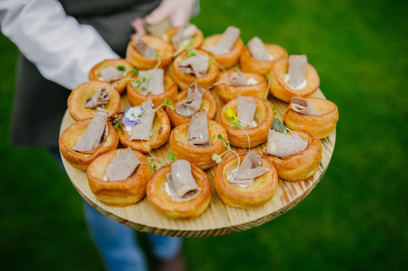 Yorkshire pudding canapés served on the lawn during the drinks reception at Danby Castle