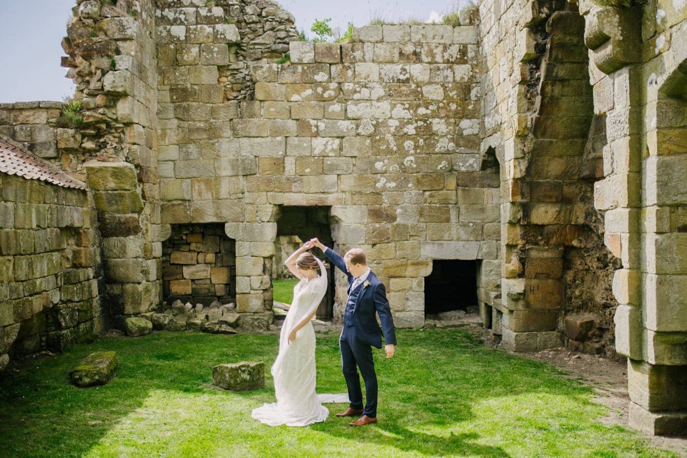 Ellie and George in the open courtyard inside the Danby Castle ruins