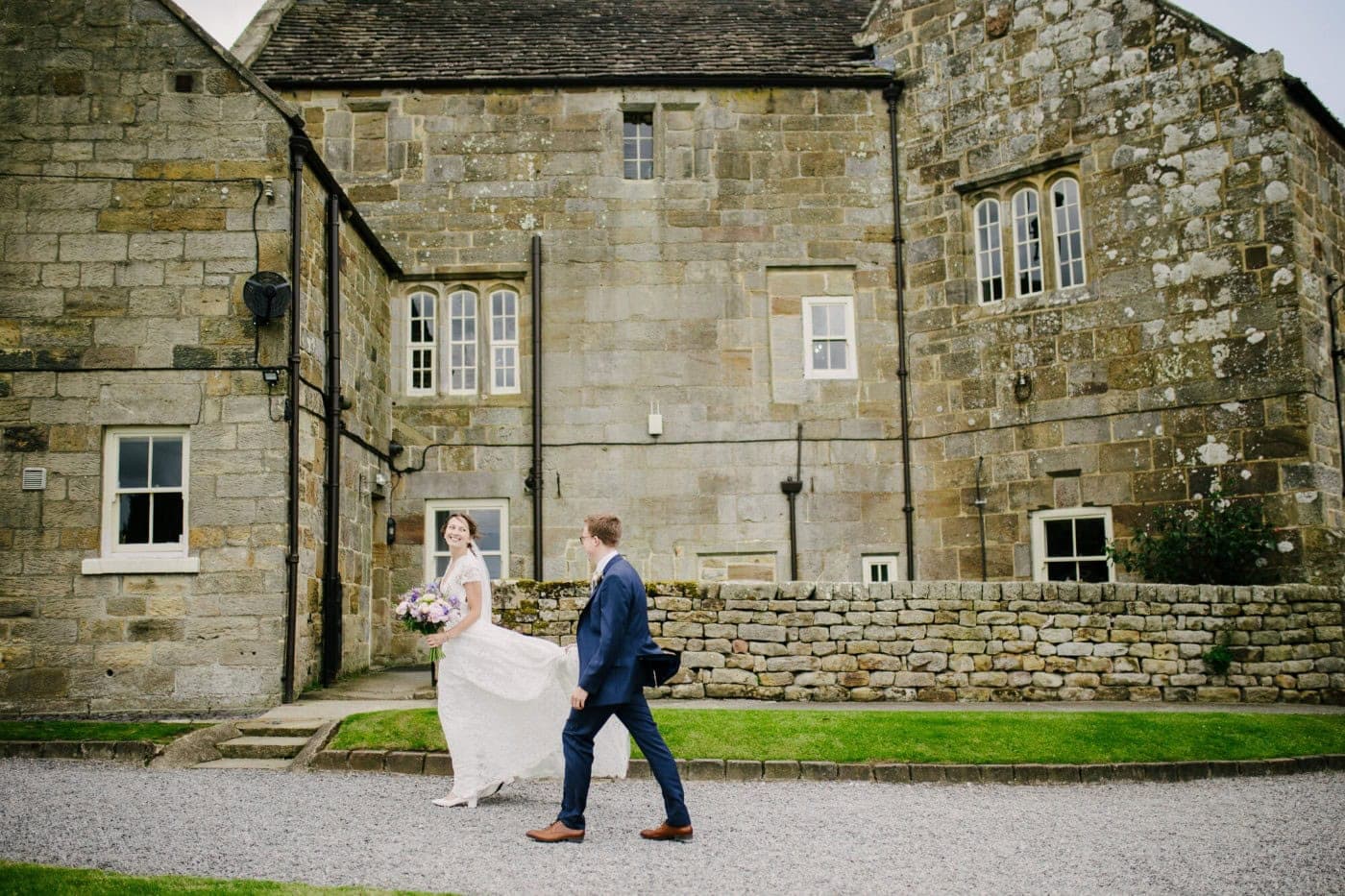Ellie and George walking past the old working farmhouse at Danby Castle near Whitby