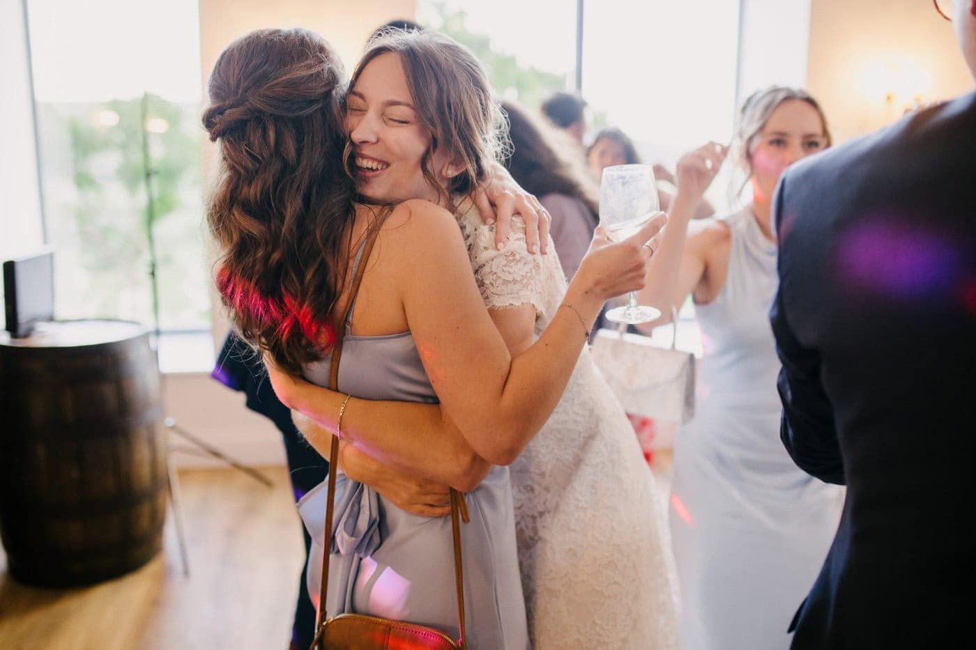 Ellie hugging a friend on the dance floor late in the evening