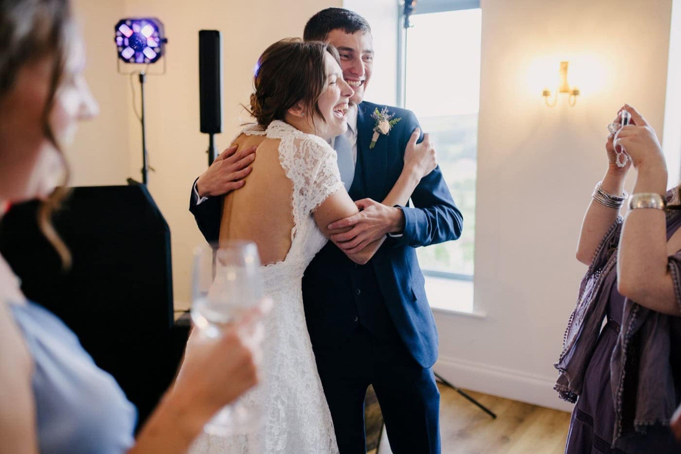 Ellie and George dancing together at the end of their Danby Castle wedding day