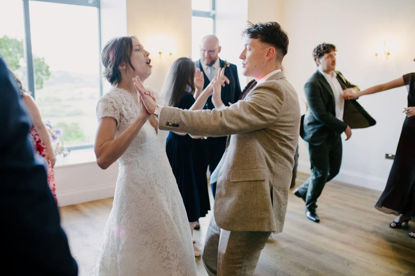 Ellie dancing with a guest at the evening reception